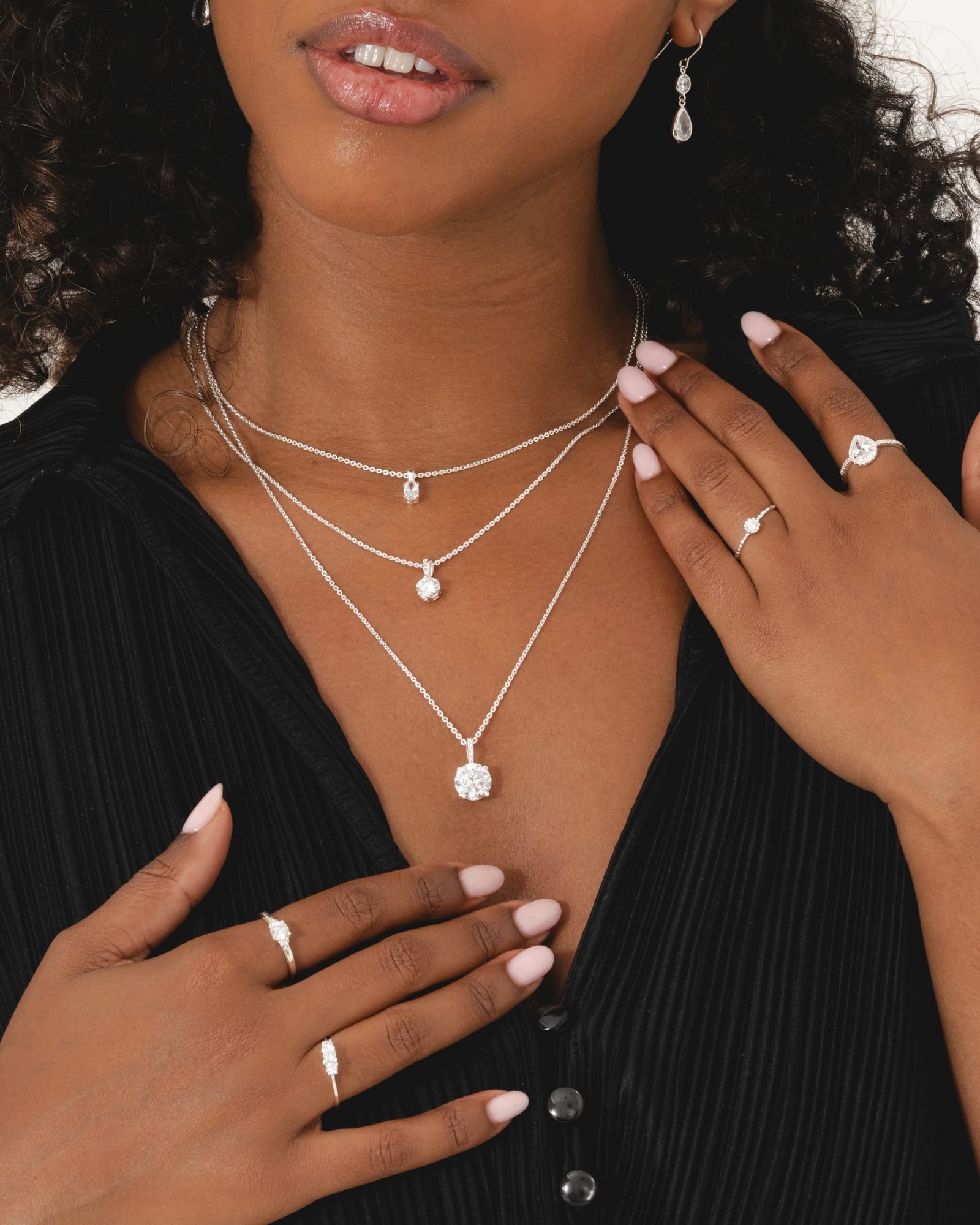 Sterling silver ring featuring a dainty bobble band and a sparkling cubic zirconia solitaire stone.