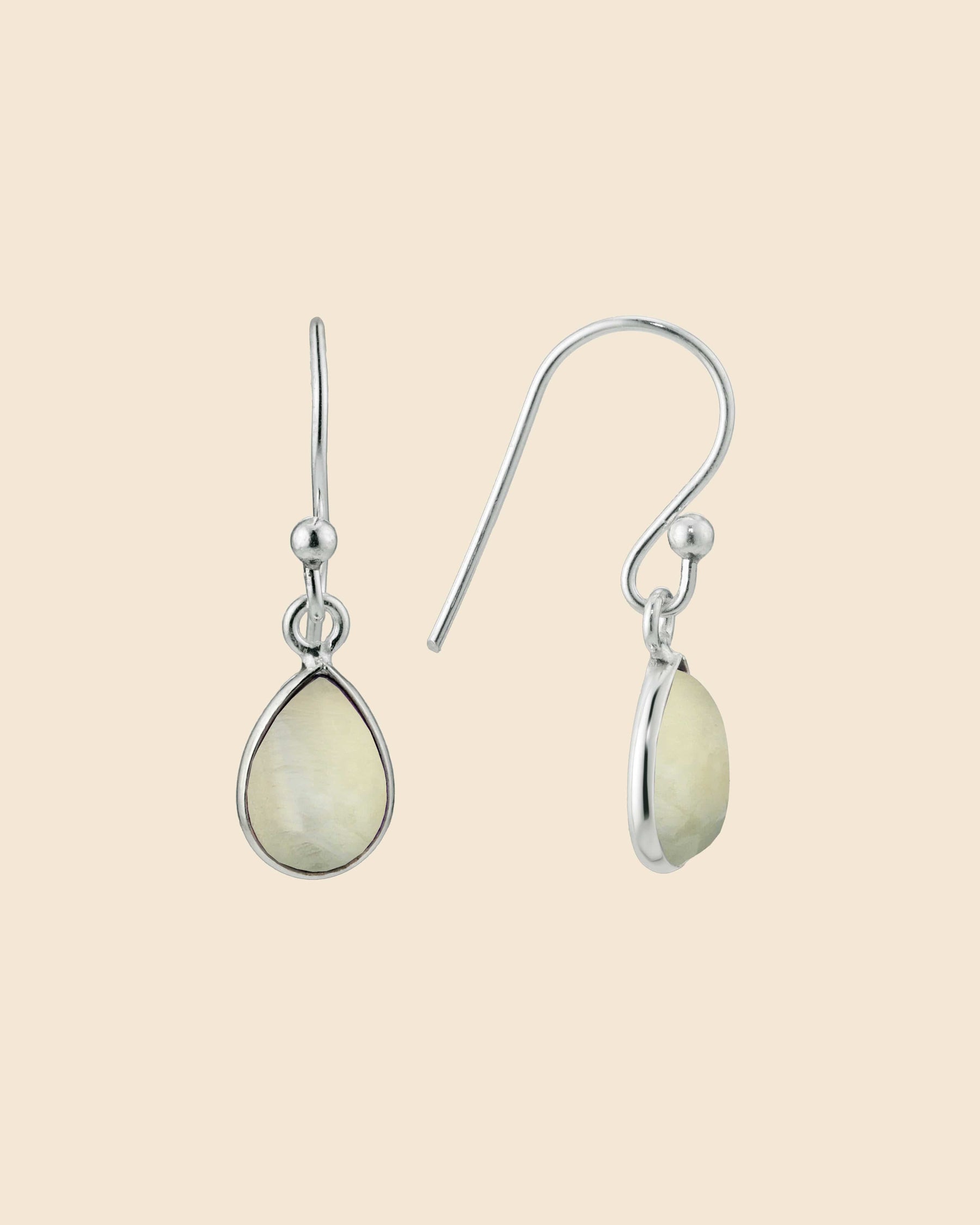 Sterling silver teardrop earrings featuring smooth, pale gemstone drops on simple hook wires.