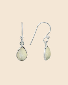 Sterling silver teardrop earrings featuring smooth, pale gemstone drops on simple hook wires.