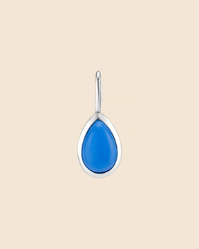 Mini teardrop pendant in polished sterling silver featuring a smooth, vibrant blue gemstone.