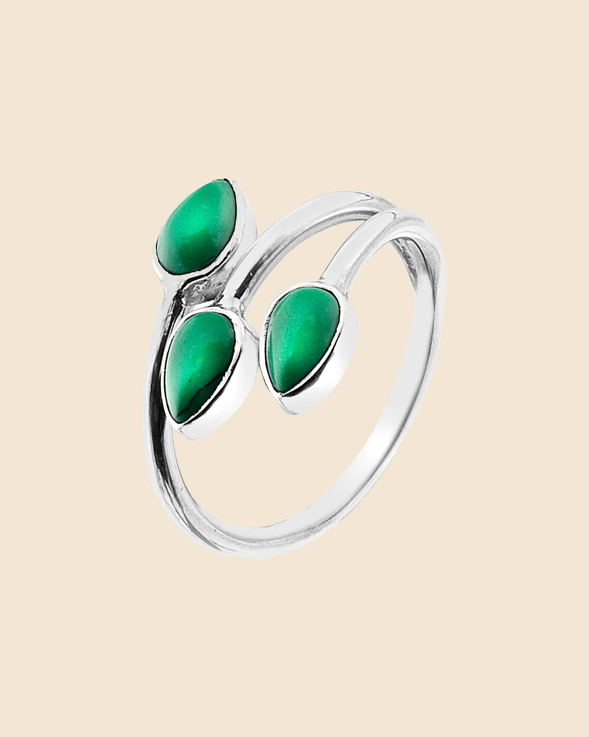 Sterling silver wrap-around ring featuring three vibrant green teardrop gemstones in a modern split-arm design.