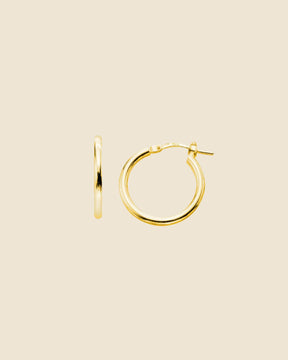 Pair of 20mm gold-plated hoop earrings with a sleek, polished finish and a secure flip-top closure.