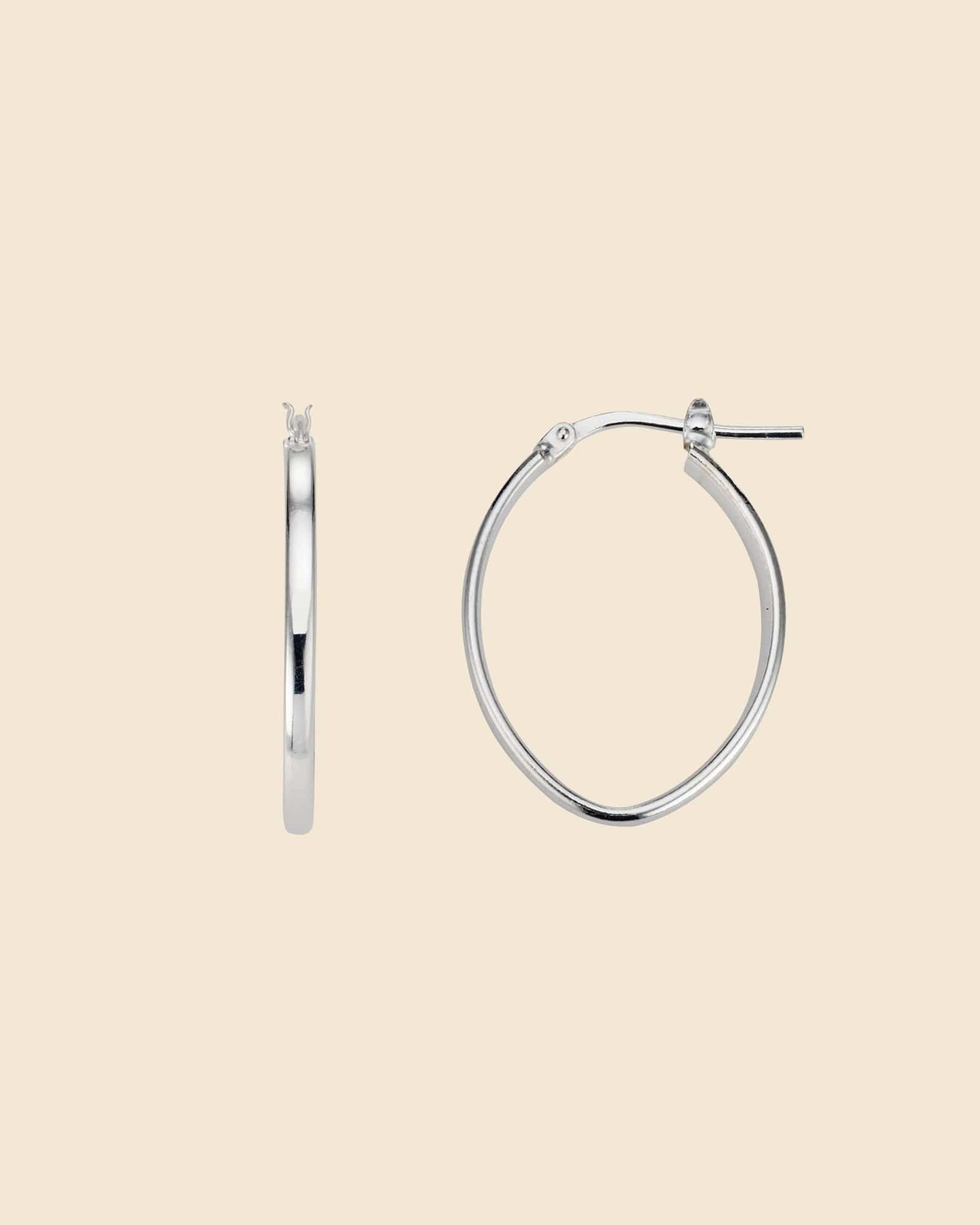 Polished sterling silver hoop earrings with a modern, elongated pointed oval shape.