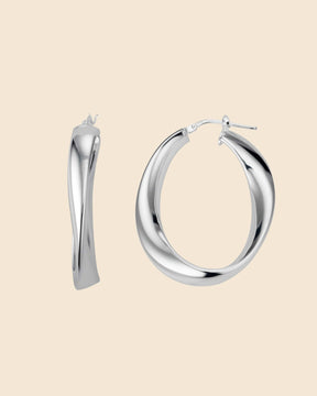 Polished sterling silver chunky hoop earrings with an organic, twisted O-shape design.