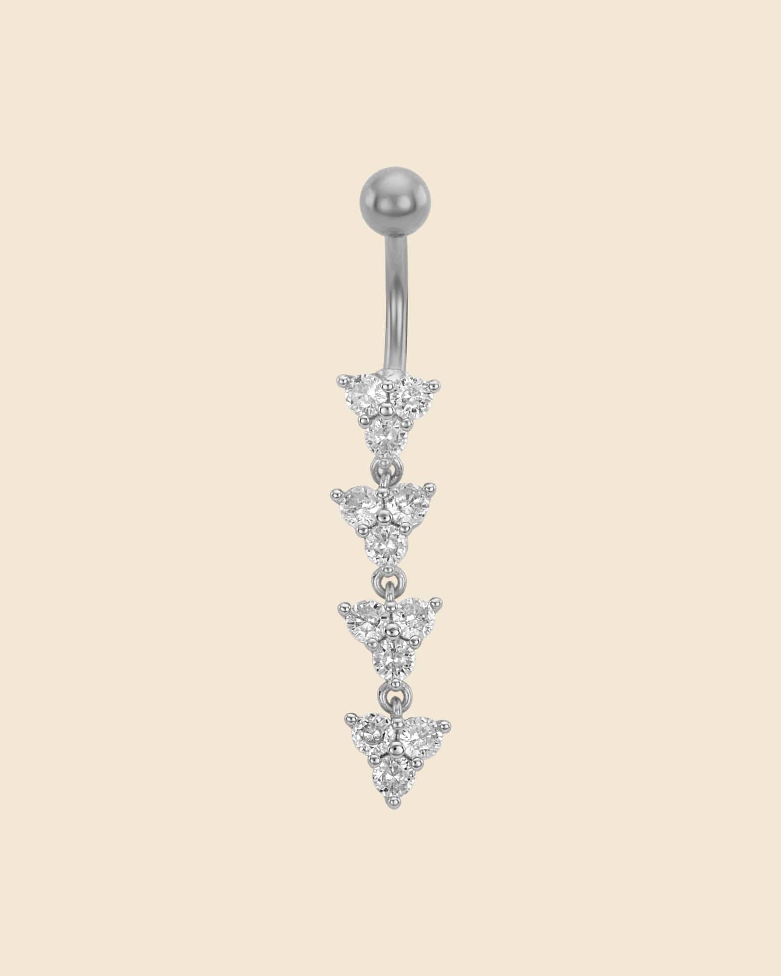 Surgical steel navel bar with four cascading triangle charms featuring sparkling claw-set crystals.