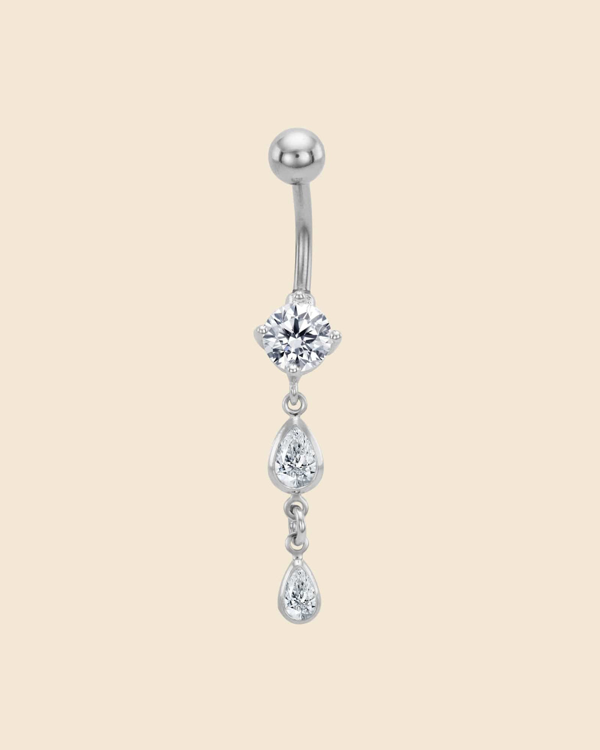 Surgical steel navel bar with a claw-set crystal and two dangling teardrop-shaped crystals.
