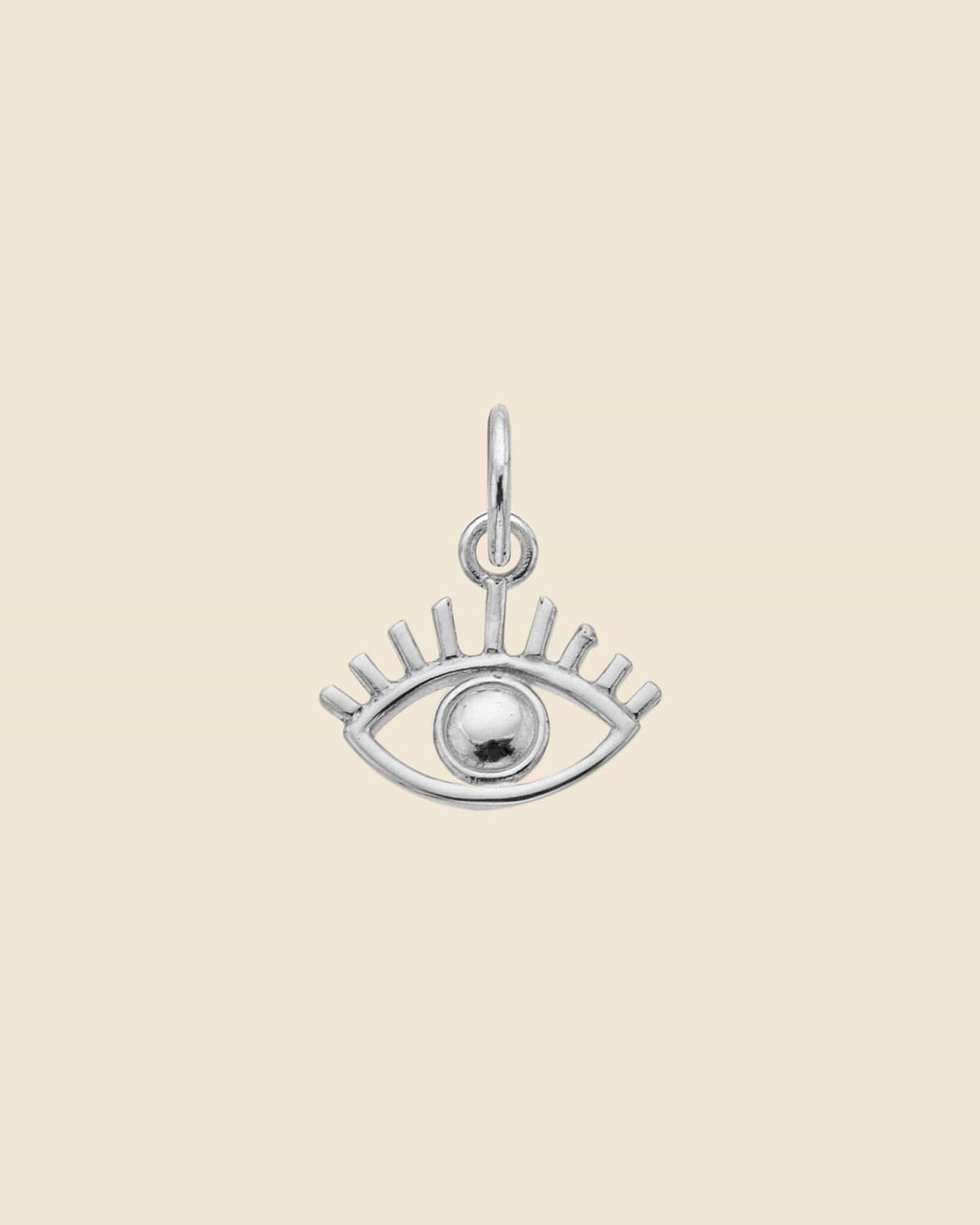 Dainty sterling silver evil eye pendant with a polished center bead and stylized eyelash detailing.