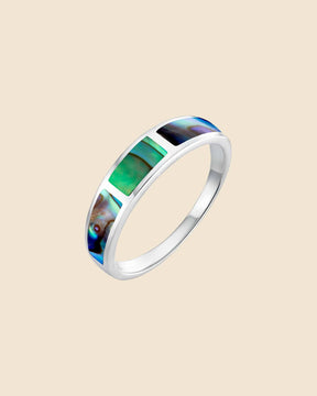 Polished sterling silver ring featuring rectangular paua shell inlays with shimmering green, purple, and turquoise tones.