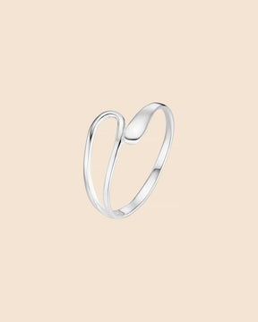 Minimalist sterling silver ring featuring a sleek, looped band design with smooth, curved ends on a soft beige background.