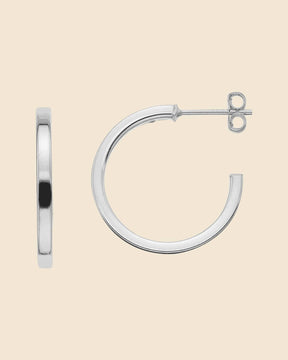 20mm sterling silver hoop earrings featuring a polished square tube design with secure post backings.