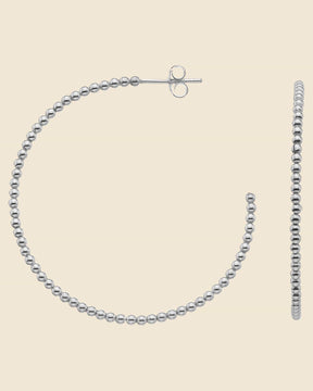 40mm sterling silver hoop earrings featuring a textured bobble design with post back closures.